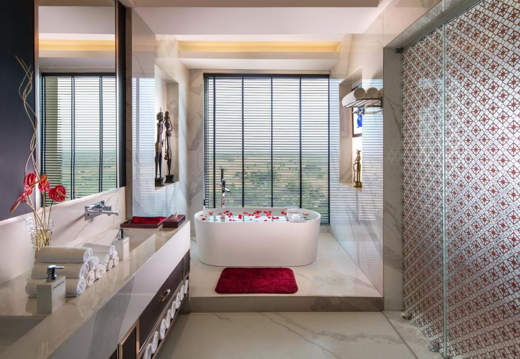 Romantic Bathtub in Noida Sandal Suites by Lemon Tree Hotels